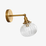 Cargar imagen en el visor de la Galería, Antique brass ribbed glass wall sconce on a clean background