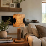 Cargar imagen en el visor de la Galería, Black dot loofah table lamp lit beside a sofa