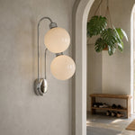 Afbeelding laden in galerijweergave, Milk coffee glass globe wall lamp above a vanity table