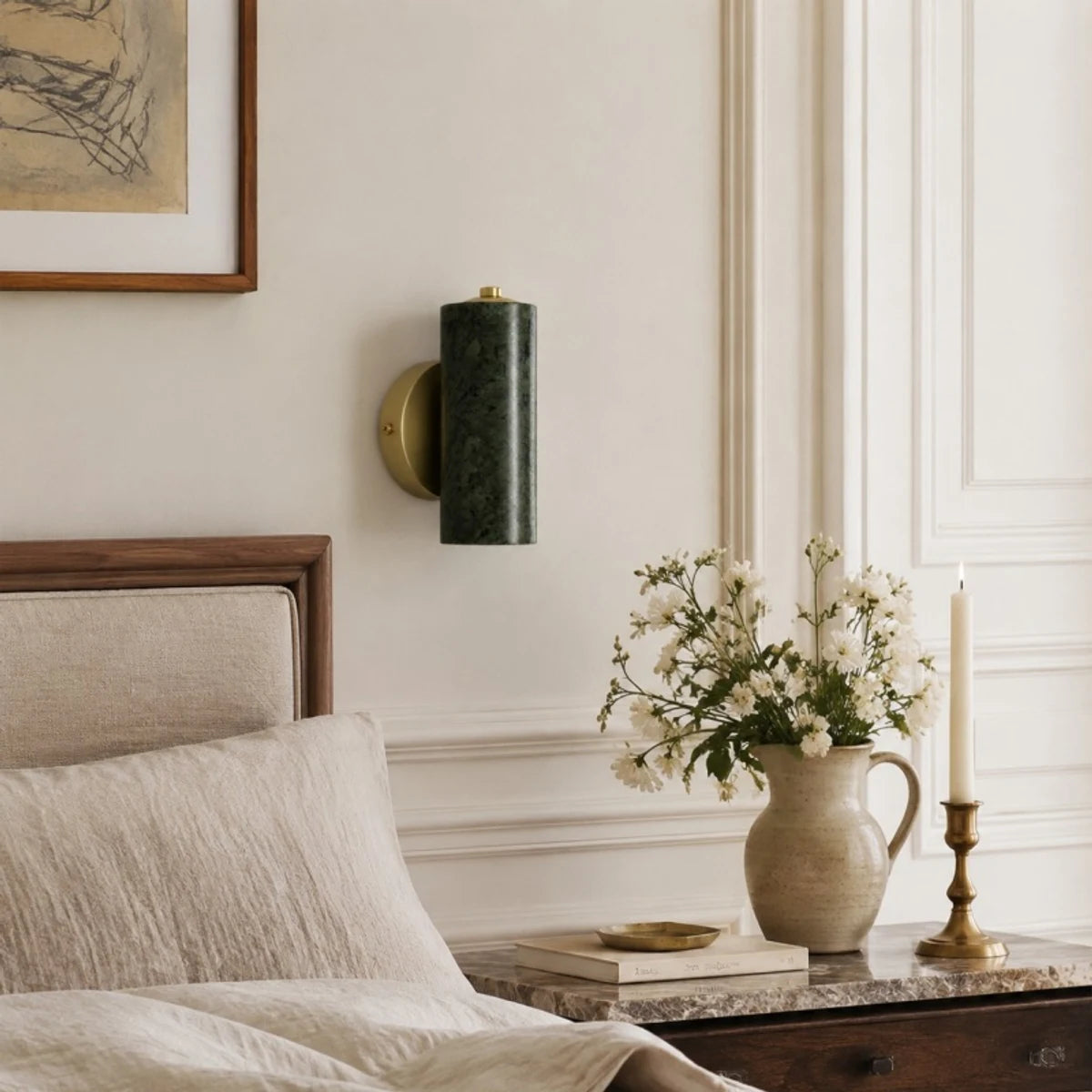 Green jade wall lamp styled above a bedside table