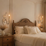 Carica l'immagine nella visualizzazione Galleria, One-light wall sconce installed beside a bedroom headboard