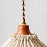 Load image into Gallery viewer, Close-up of twisted brown cord, brass fitting and warm wood socket cover