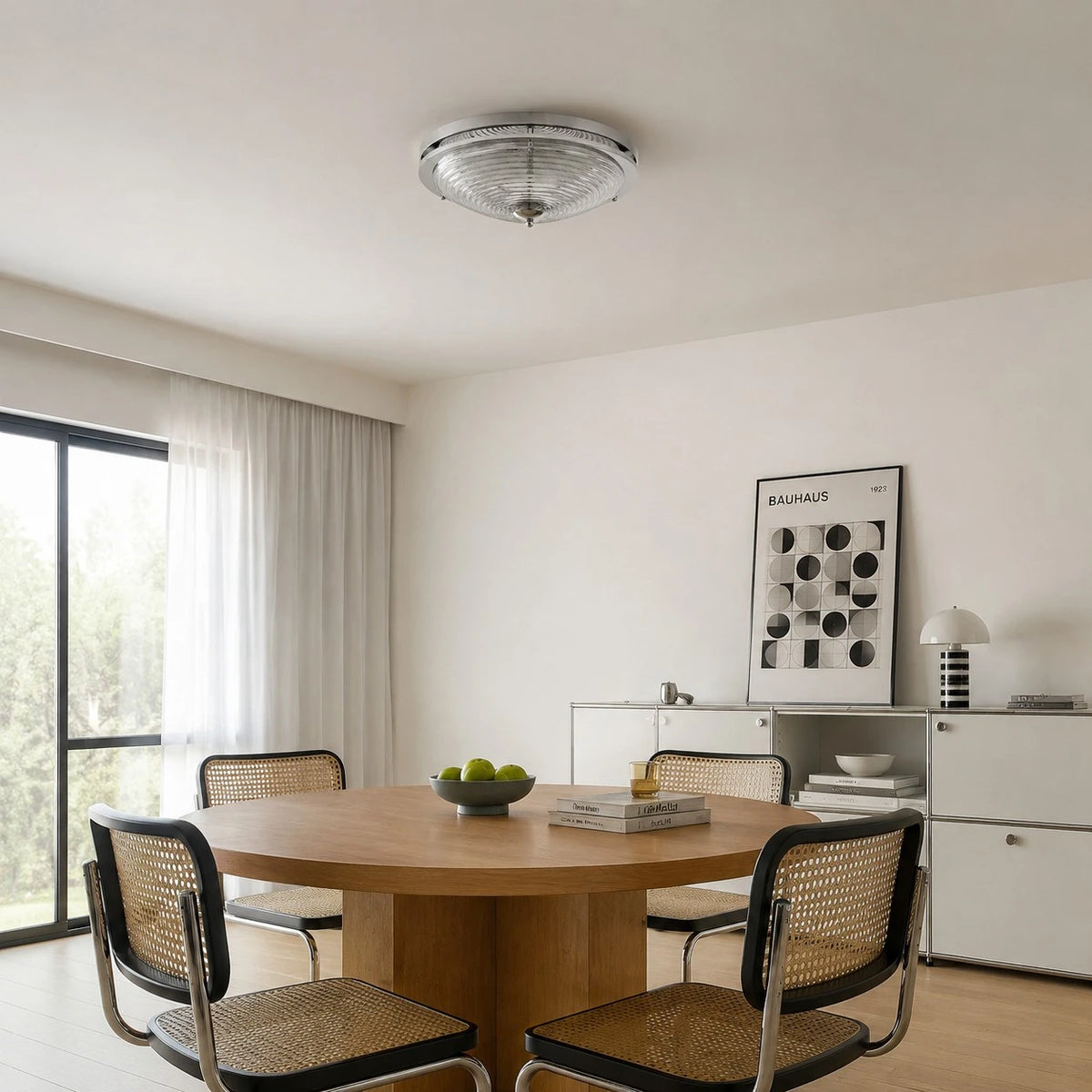 Bauhaus rippled glass ceiling light installed above a dining table