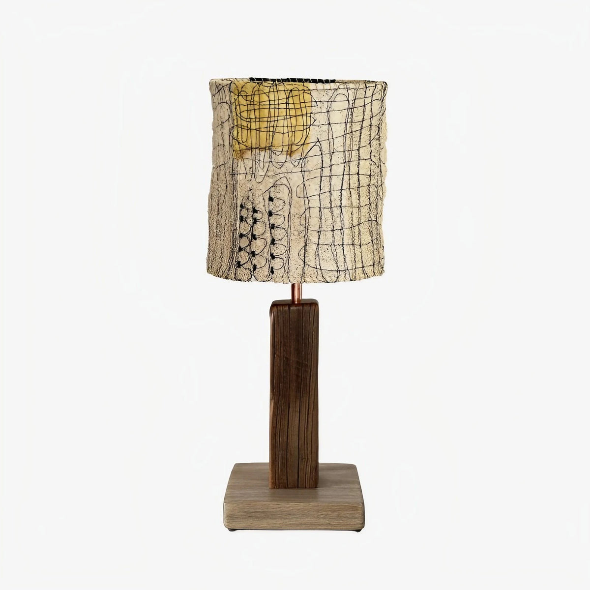 Yellow patch shade loofah table lamp on a white background