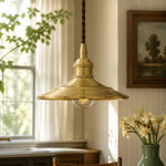 Load image into Gallery viewer, Polished brass pendant light in a warm kitchen setting