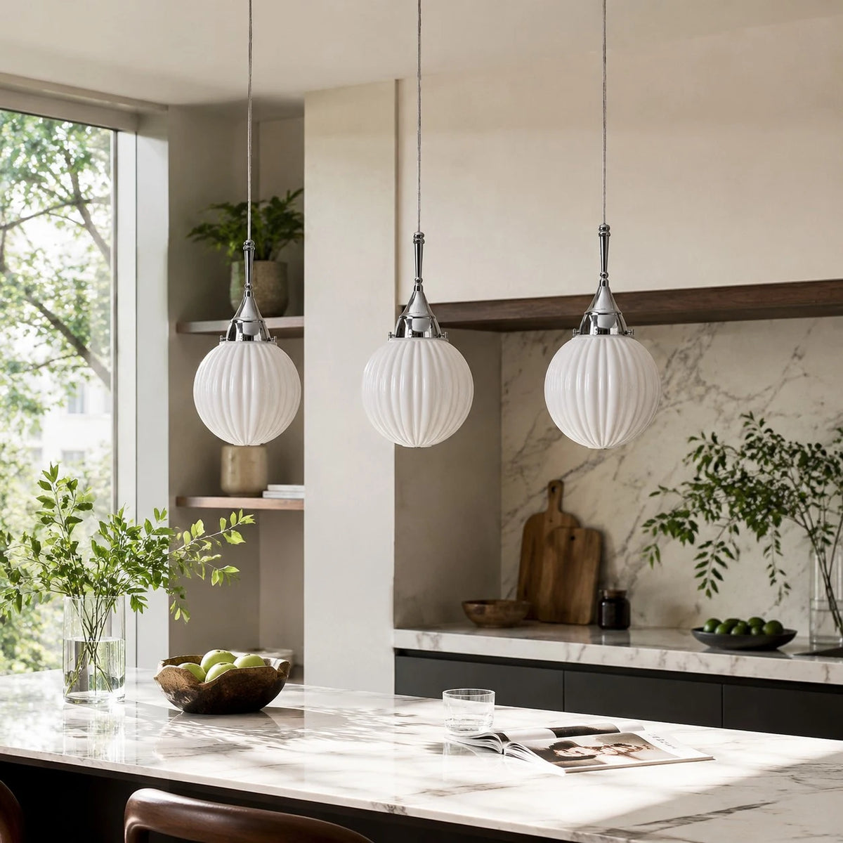 Three ribbed glass pendants above a kitchen island