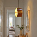Cargar imagen en el visor de la Galería, Hand-laced leather cylinder pendant light in an interior setting