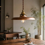 Afbeelding laden in galerijweergave, Distressed gold pendant light in a dining room