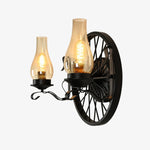 Załaduj obraz do przeglądarki galerii, Black wagon wheel wall sconce with two light heads