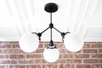 Load image into Gallery viewer, Glorica Glass Chandelier - Brass Globe Ceiling Light with Opal Shade
