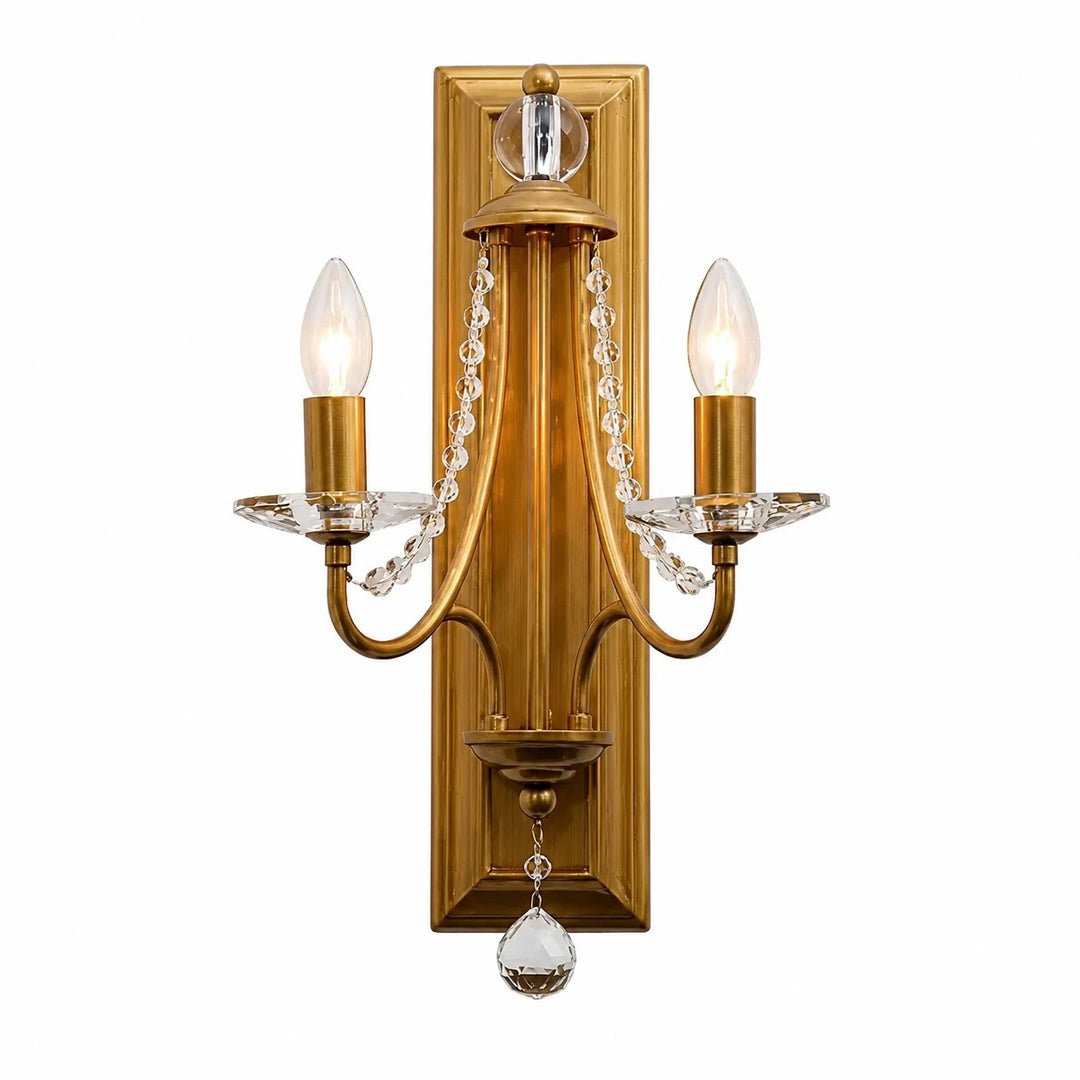 Vintage brass crystal double wall sconce on a white background