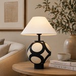 Afbeelding laden in galerijweergave, ceramic globe table lamp in warm lounge setting