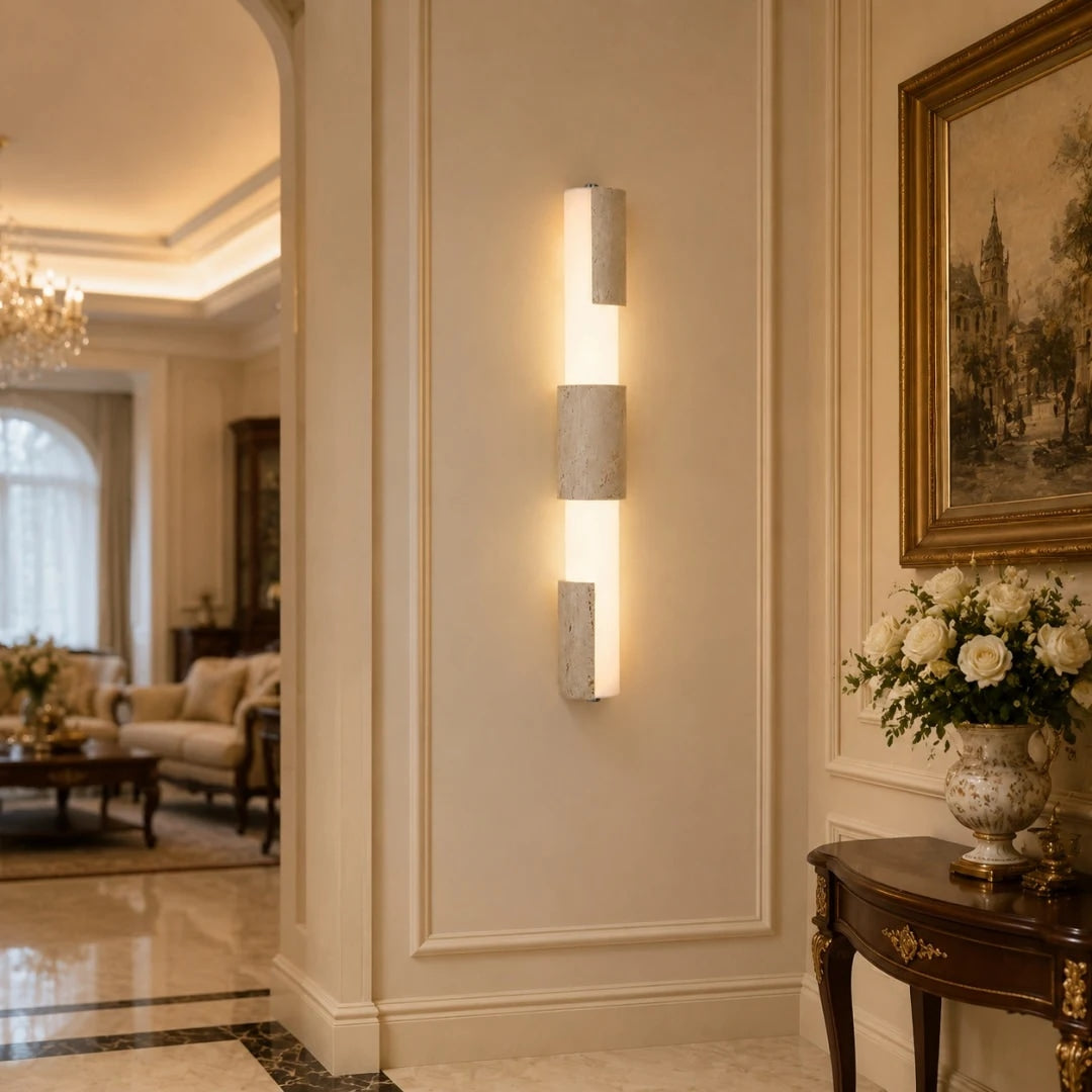 Travertine acrylic wall lamps lighting a warm classic entry wall