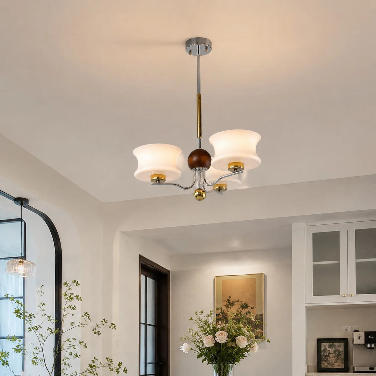 White glass chandelier mounted close to the ceiling