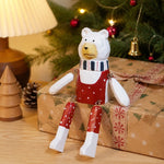 Bild in die Galerieansicht laden, Hand-carved wooden christmas polar bear ornament styled on a tabletop edge