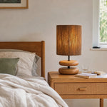 Cargar imagen en el visor de la Galería, Walnut tone table lamp on a nightstand in a calm bedroom