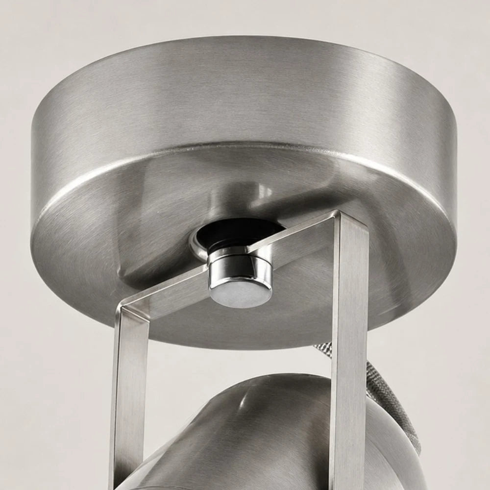 Close view of the round metal mounting base and bracket