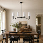 Load image into Gallery viewer, Strellux black linear chandelier in a dining room setting