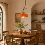 Cargar imagen en el visor de la Galería, Orange metal and ceramic pendant lamp in a warm kitchen dining nook