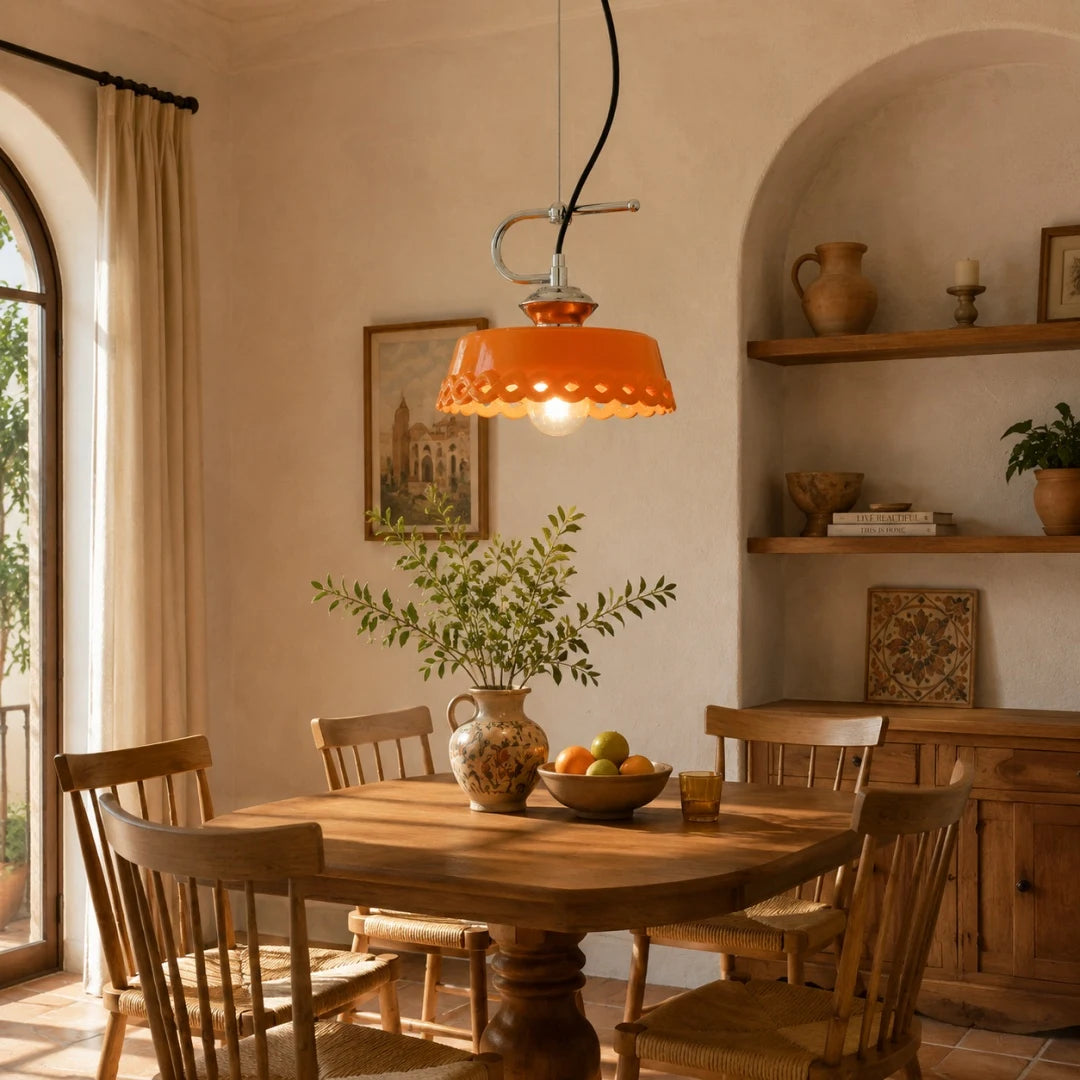Orange metal and ceramic pendant lamp in a warm kitchen dining nook
