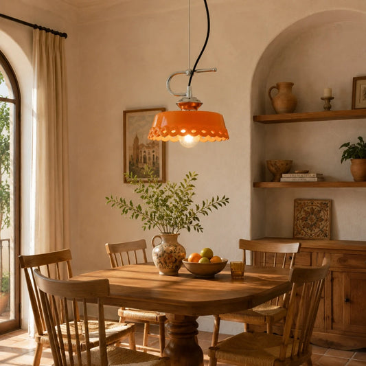 Orange metal and ceramic pendant lamp in a warm kitchen dining nook