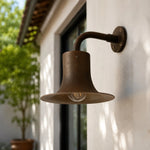 Cargar imagen en el visor de la Galería, Antique brass wall sconce installed on an exterior wall in daylight