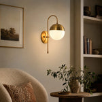 Carica l'immagine nella visualizzazione Galleria, Gold milk glass wall lamp in a modern living room