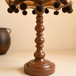 Cargar imagen en el visor de la Galería, Close view of the turned brown table lamp base and pom pom trim