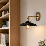 Cargar imagen en el visor de la Galería, Black pleated ceramic wall sconce installed near a bookshelf