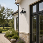 Load image into Gallery viewer, Black seeded-glass wall lamp on a bright architectural wall