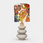 Bild in die Galerieansicht laden, Sculptural floral fabric shade ceramic table lamp front view