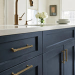 Afbeelding laden in galerijweergave, Antique brass pulls installed on blue kitchen cabinetry