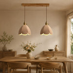 Cargar imagen en el visor de la Galería, Two natural leather pendant lights above a dining table