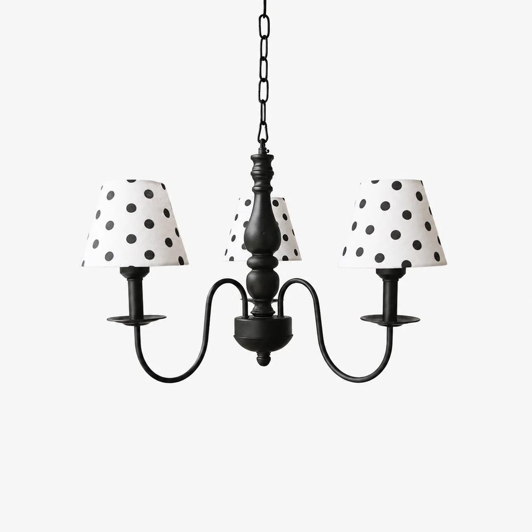 Three-light black chandelier with cream polka dot fabric shades