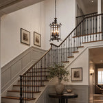 Afbeelding laden in galerijweergave, Black iron pendant installed over a stair landing