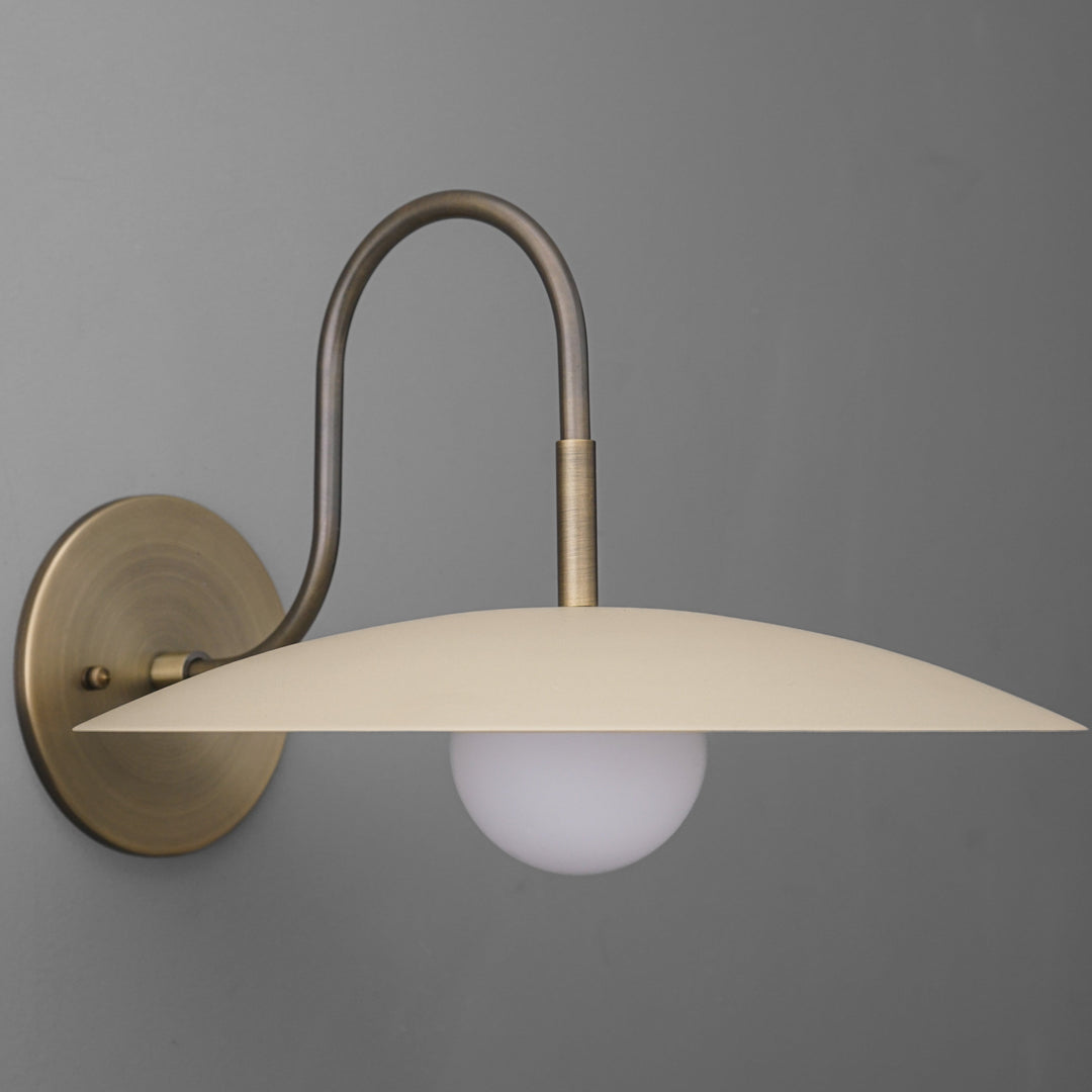 Curva Metal Modern Wall Sconce - Antique Brass Arm with Cream Disc Shade