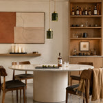 Cargar imagen en el visor de la Galería, Two green jade cylinder pendant lights above a warm wood and marble dining table