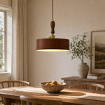 Load image into Gallery viewer, Vintage brown leather pendant installed above a wood dining table