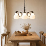 Afbeelding laden in galerijweergave, Five-heads chandelier above a wood dining table