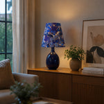 Afbeelding laden in galerijweergave, Blue floral ceramic table lamp styled near a window