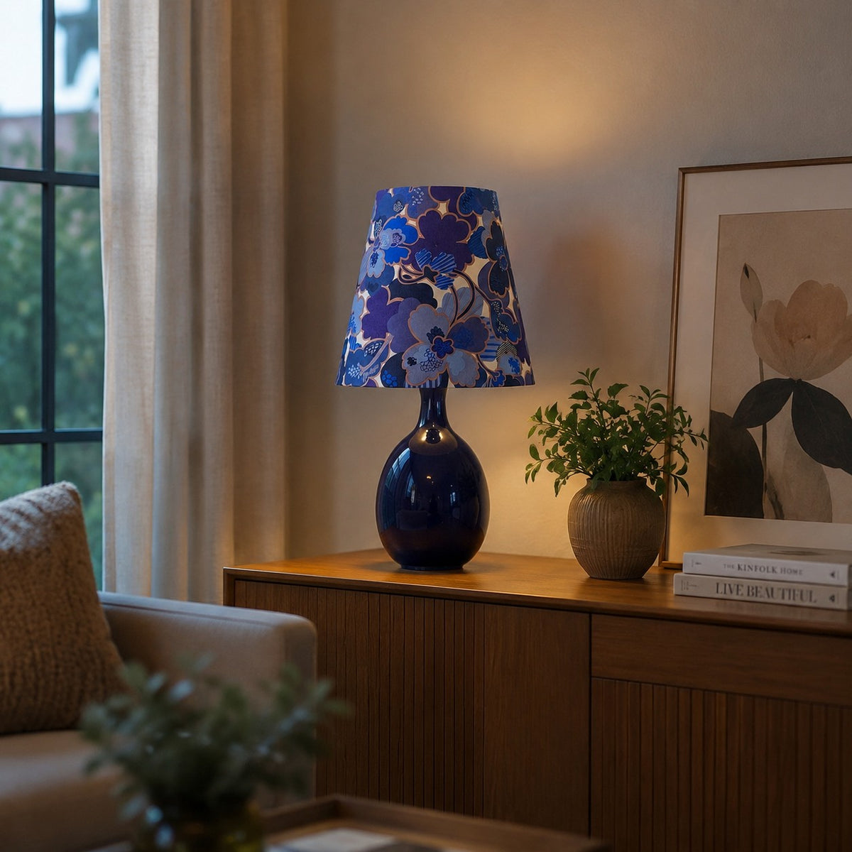 Blue floral ceramic table lamp styled near a window