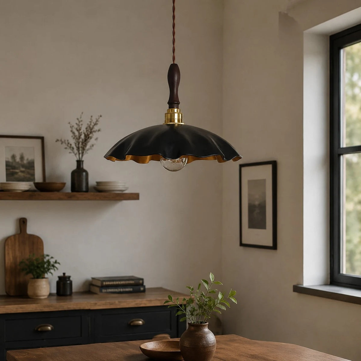 black cowhide pendant light over a warm dining table near a window