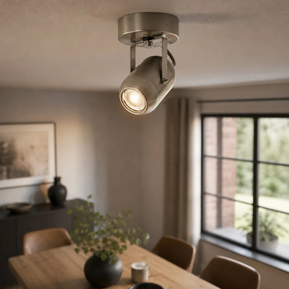 Sand nickel wall lamp used as warm accent lighting in a dining room