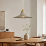 Bild in die Galerieansicht laden, Aged brass pendant lamp over a warm dining table