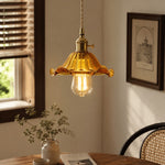 Charger l'image dans la visionneuse de la galerie, Style L amber glass pendant glowing beside a rattan chair