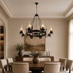 Afbeelding laden in galerijweergave, Eight-light wagon wheel chandelier above a large round dining table