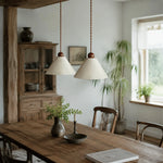 Cargar imagen en el visor de la Galería, Pair of natural paper pendant lamps over a wood dining table