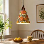 Carica l'immagine nella visualizzazione Galleria, Orange floral pendant above sunlit wooden dining table