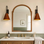 Cargar imagen en el visor de la Galería, Pair of black and red leather wall sconces installed beside a bathroom mirror