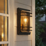 Carica l'immagine nella visualizzazione Galleria, Small bronze glass outdoor wall sconce installed beside a window